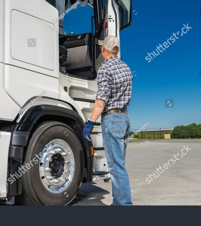 stock-photo-caucasian-semi-truck-driver-in-his-s-preparing-to-work-transportation-industry-theme-2462393915